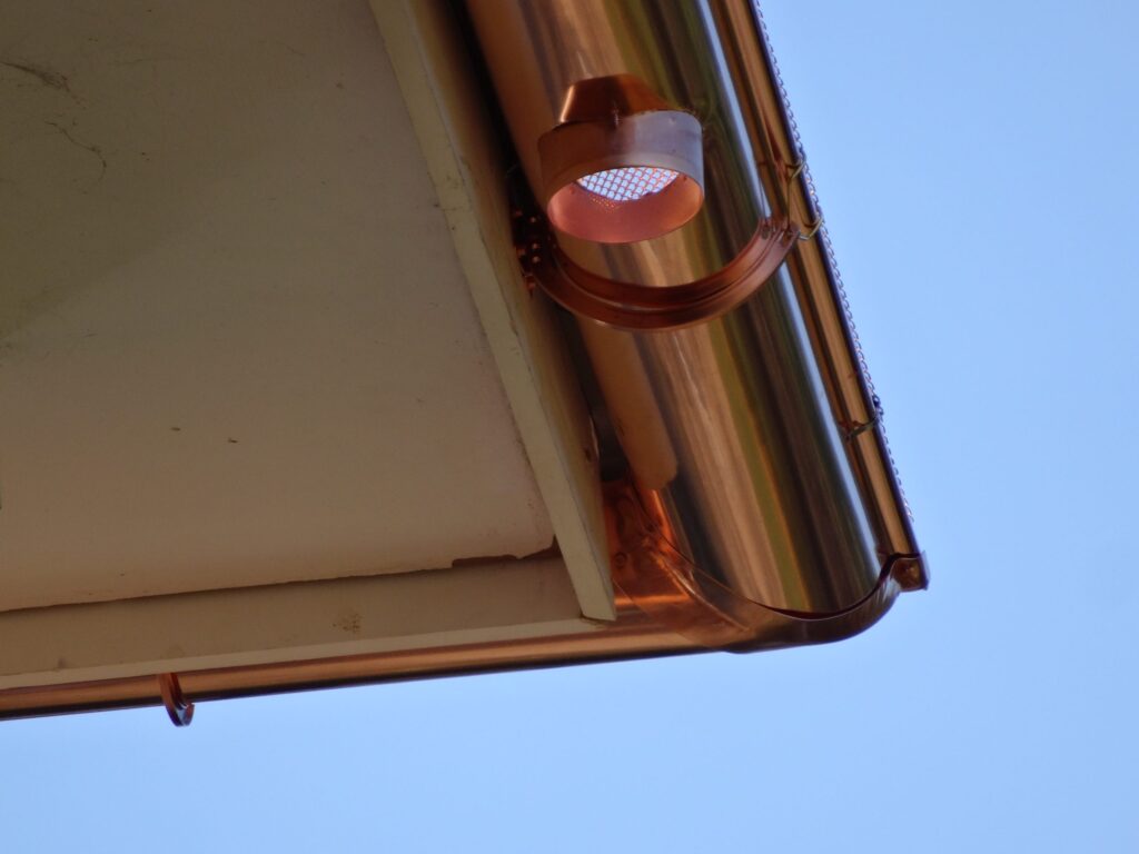 Copper gutter end detail with soldered seam