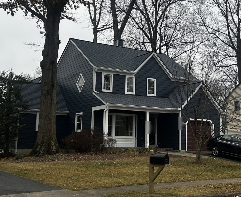 Burke, VA home after James Hardie Deep Ocean siding and a GAF Timberline HDZ Charcoal roof replacement, seen from the street