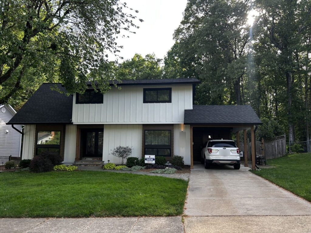 Front of a Springfield, VA home after James Hardie board and batten siding in Arctic White and a new GAF roof