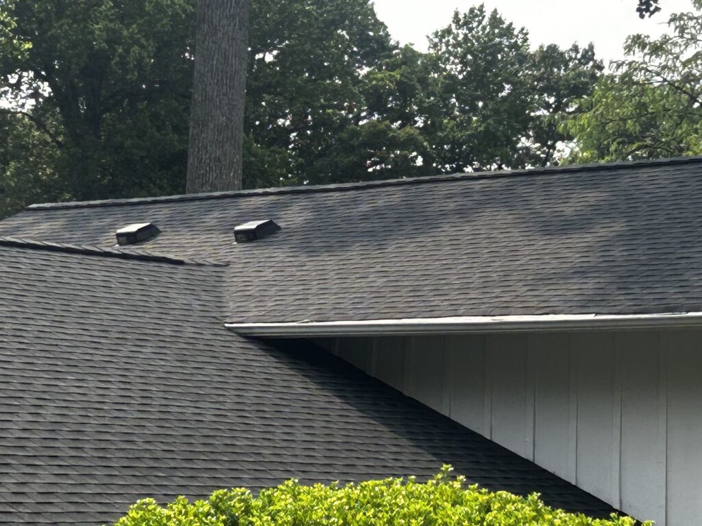 Close-up of new GAF architectural shingles and roof vents on a Fairfax County, VA home