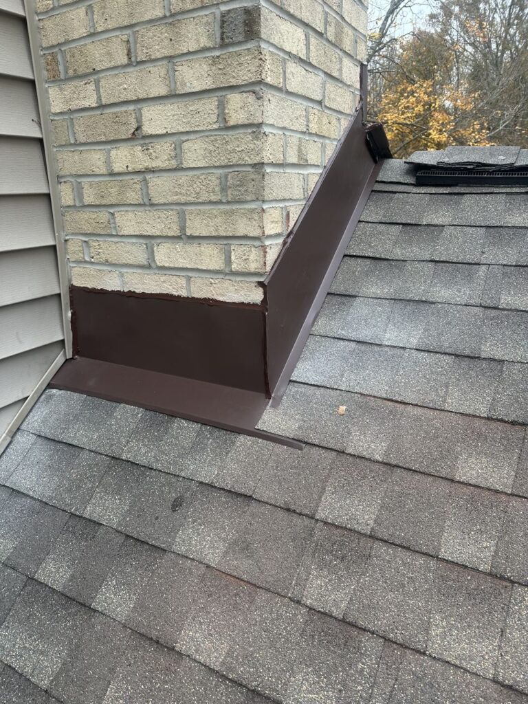 New chimney flashing on a GAF Timberline HDZ roof in Burke, VA