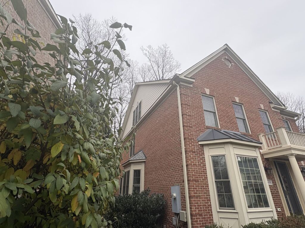 Falls Church, VA brick home with new James Hardie lap siding in Navajo Beige