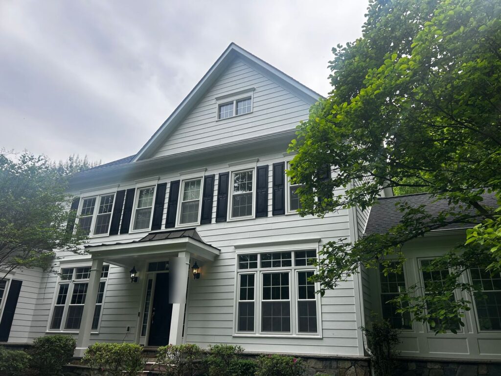 Front of a Fairfax, VA colonial with new white James Hardie lap siding