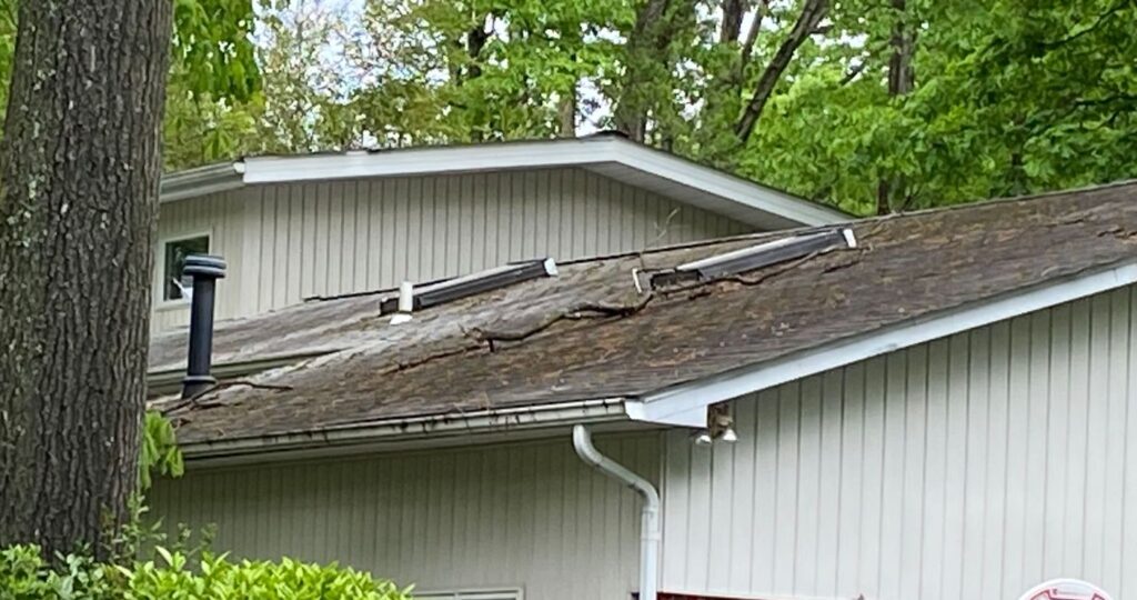 Worn, buckling old roof on a Falls Church, VA home before replacement