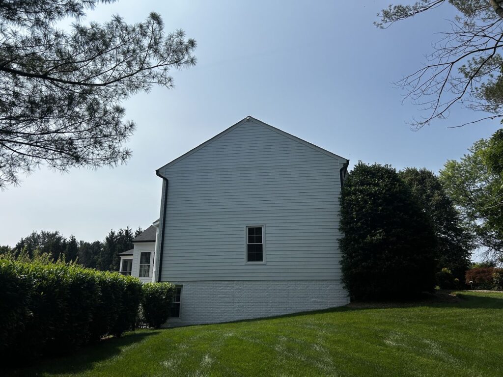 Side of a Great Falls, VA home in new white James Hardie lap siding
