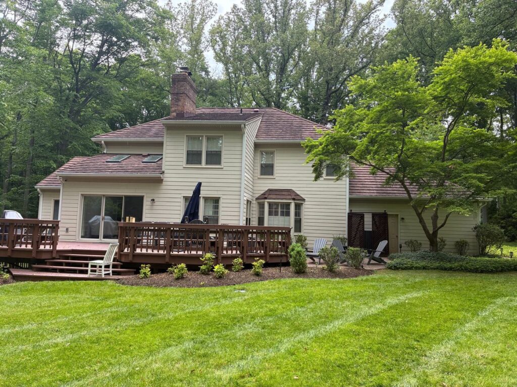 Back of a Fairfax Station, VA home with new cream James Hardie lap siding