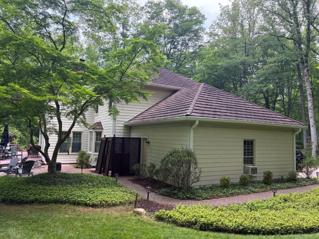 Side wing of a Fairfax Station, VA home in new cream James Hardie siding