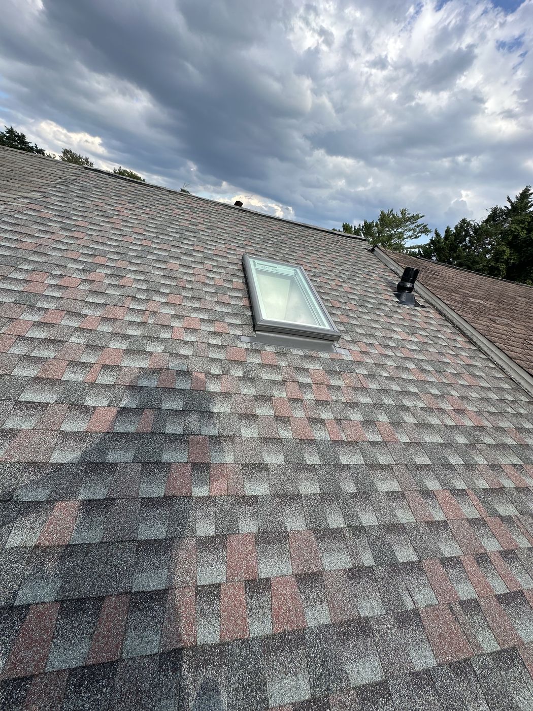 Finished GAF architectural roof with a skylight on an Alexandria, VA townhouse