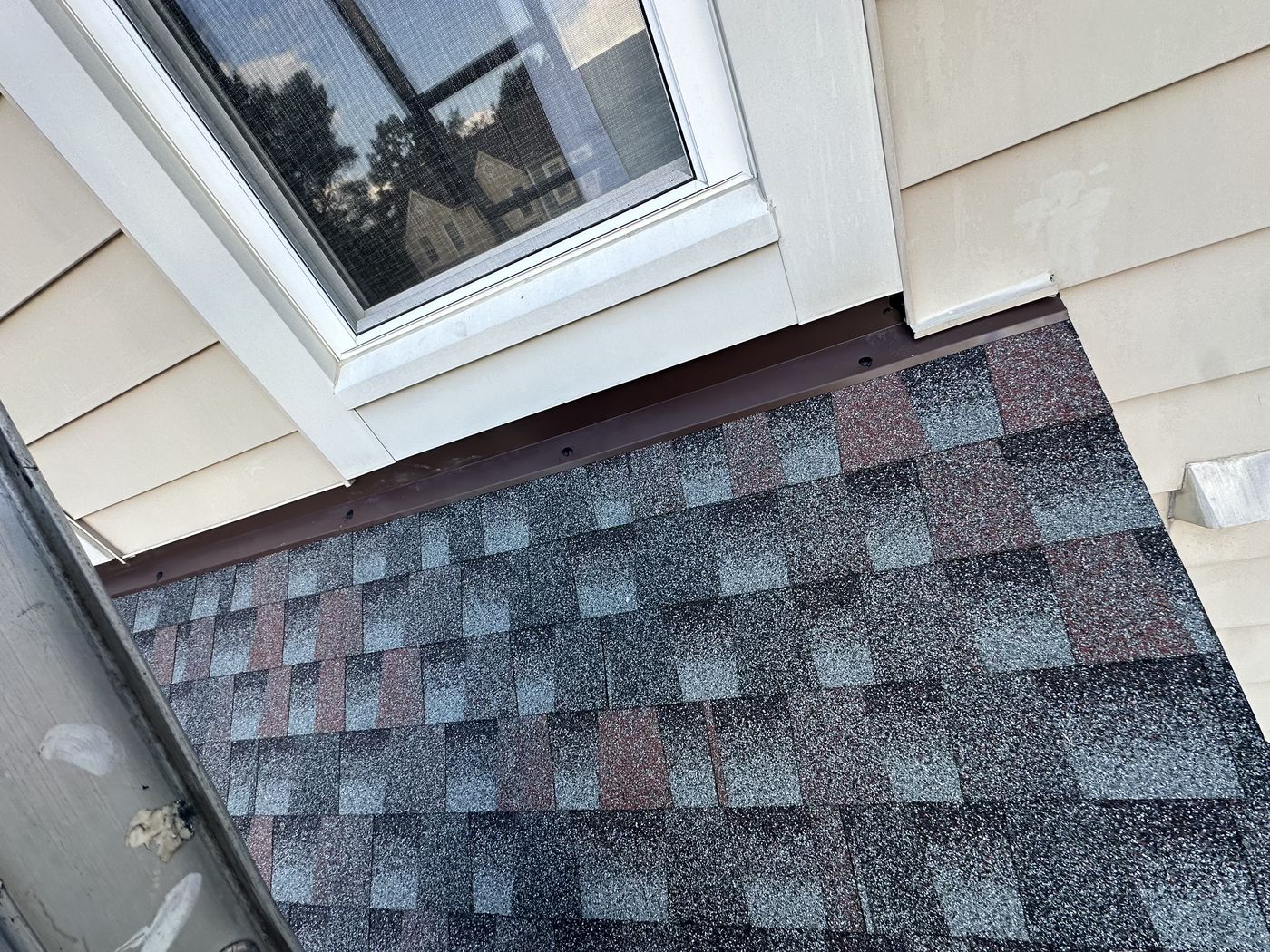 Finished GAF roof meeting the wall below a window on an Alexandria, VA home