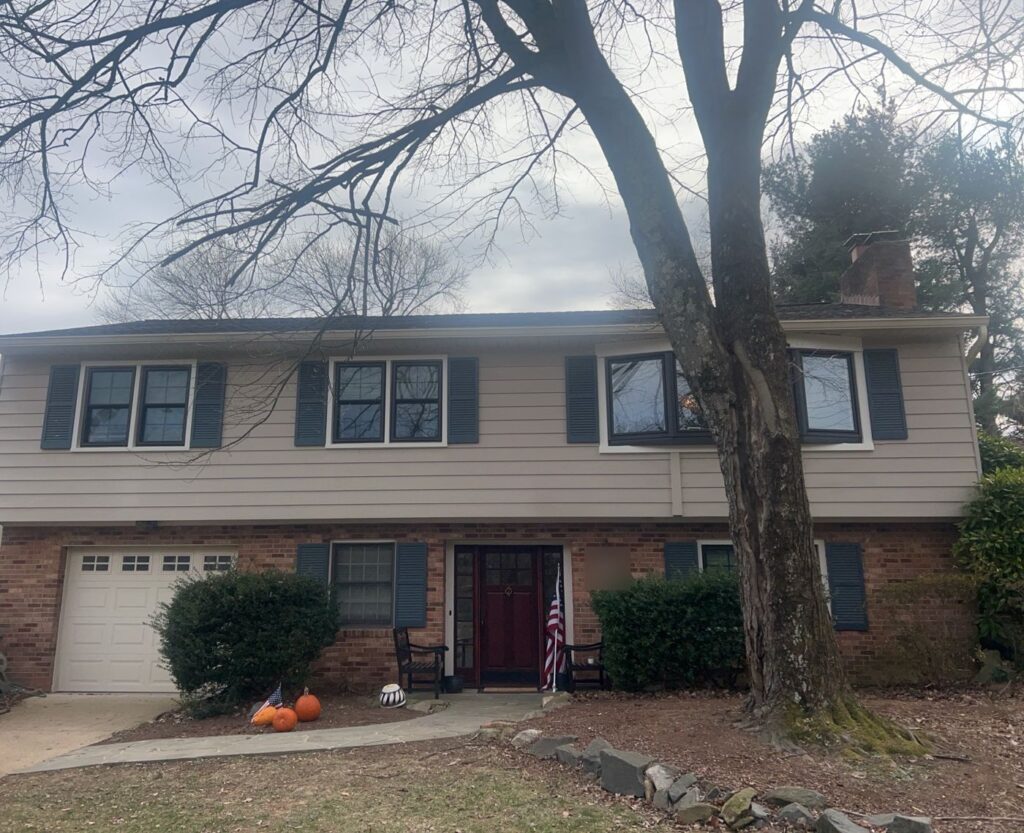 A McLean, VA home after replacement windows with black exterior frames were installed