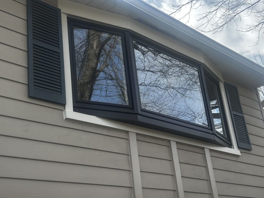 New angled ProVia bay window with a black exterior frame on a McLean, VA home
