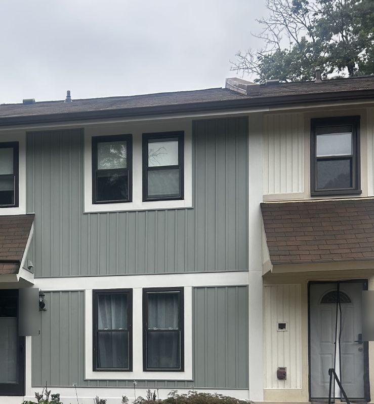 Burke, VA townhouse front after new gray board and batten vinyl siding with white trim