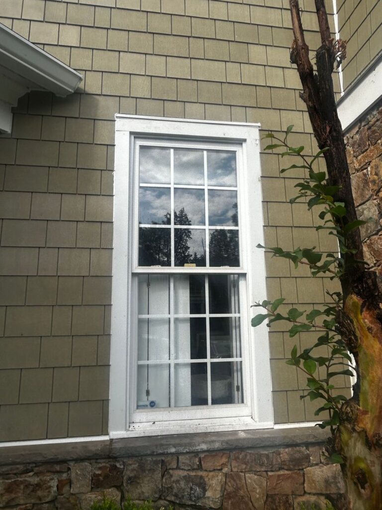 James Hardie shake siding meeting the stone front of a Sterling, VA home