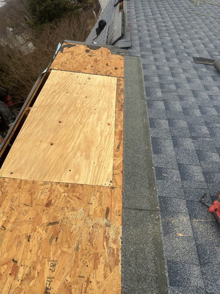 New roof decking cut in where old boards failed on a Stafford, VA home