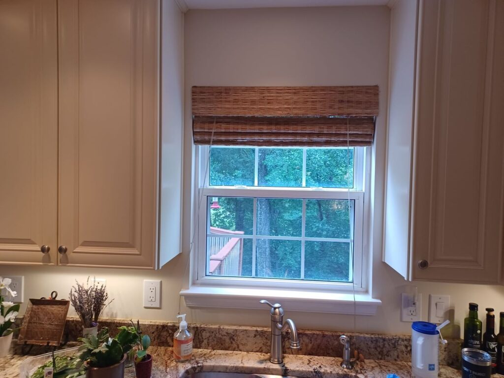 Old kitchen window over the sink in a Manassas, VA home before replacement