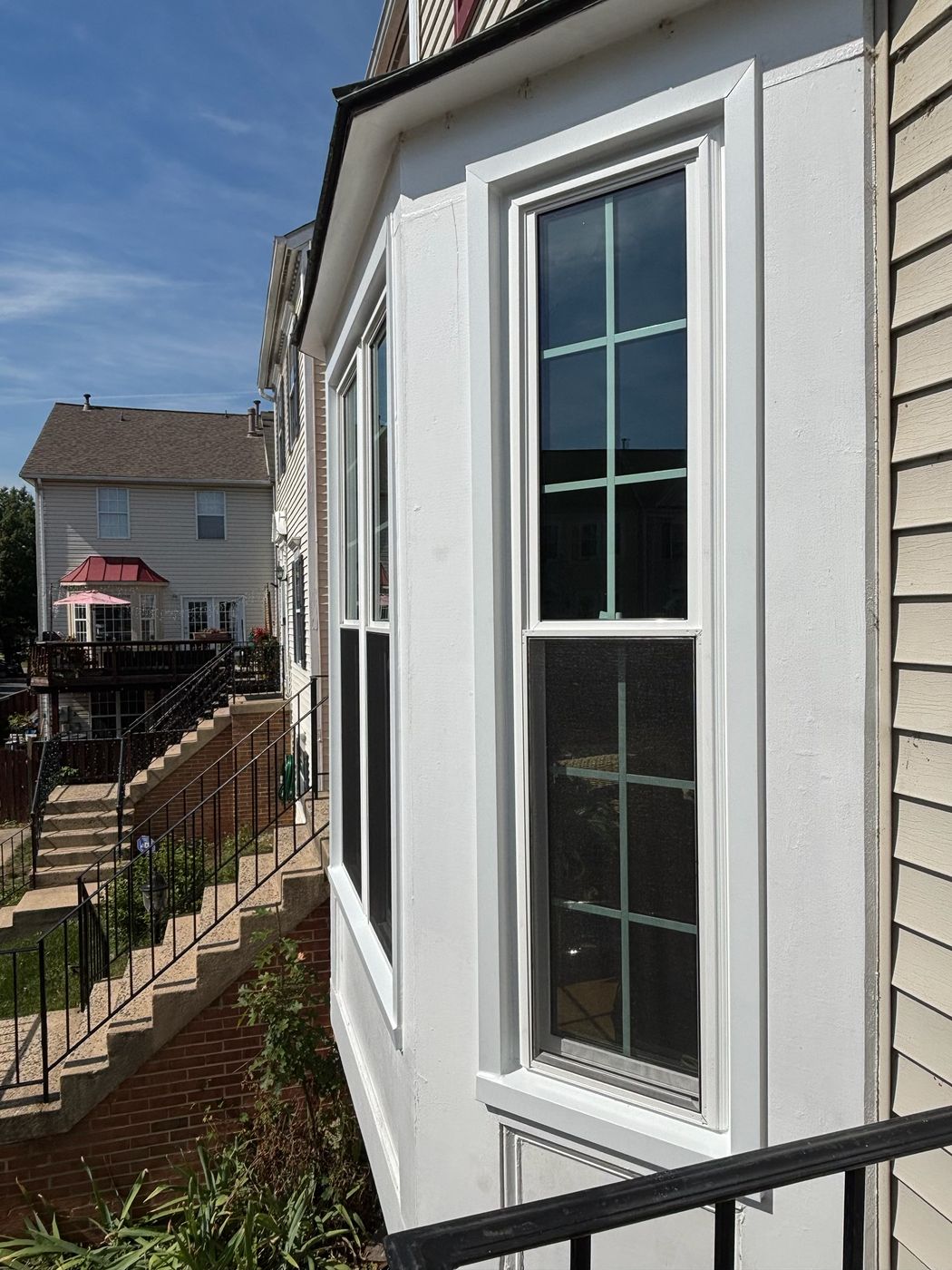 Side view of new replacement windows in a bay on a Fairfax, VA home