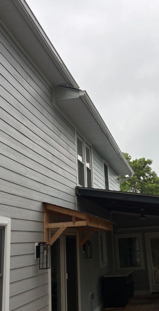 Full side wall of a Warrenton, VA home in new light gray-blue James Hardie siding